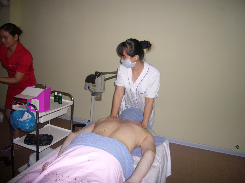 Tim having a massage at a massage salon in the city center