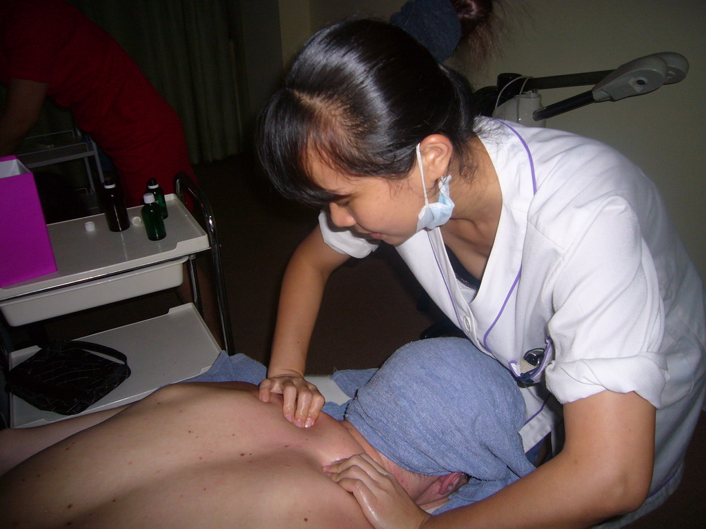 Tim having a massage at a massage salon in the city center