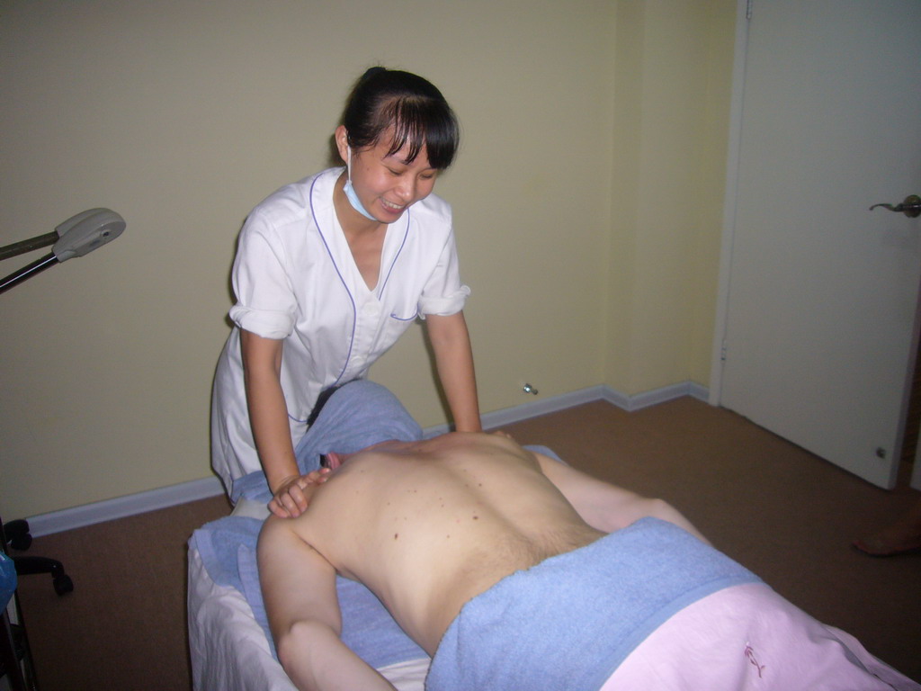 Tim having a massage at a massage salon in the city center