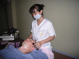 Tim having a facial massage at a massage salon in the city center