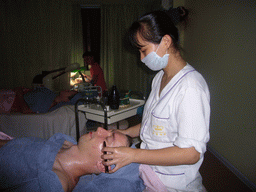 Tim and Miaomiao having a facial massage at a massage salon in the city center