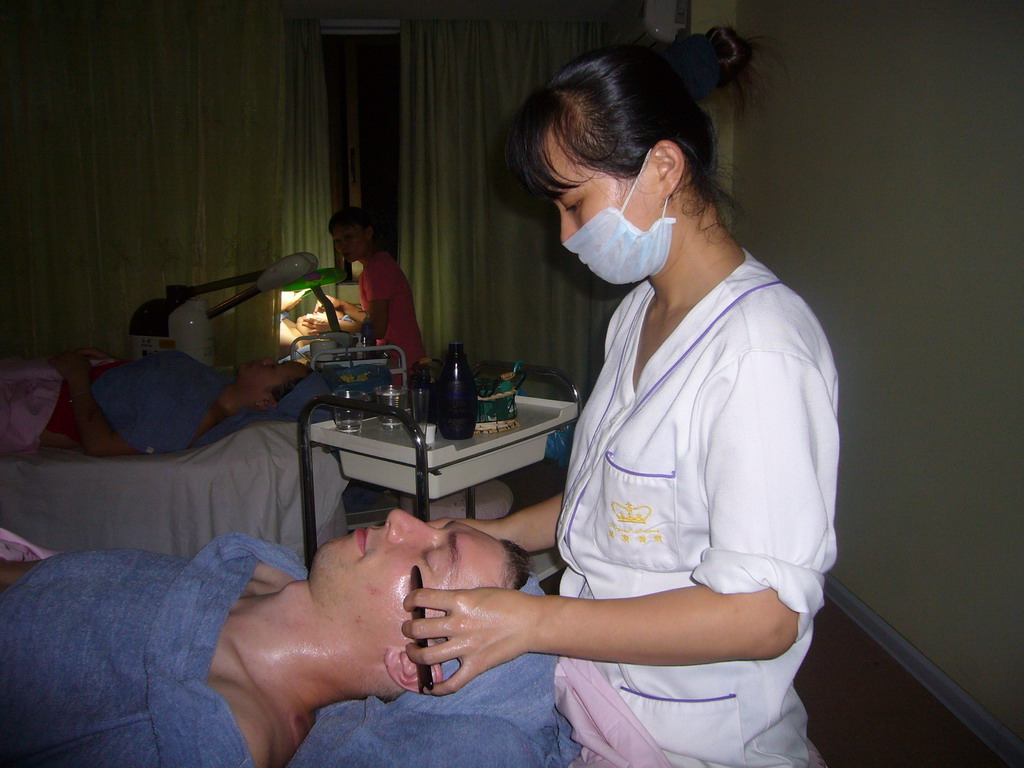Tim and Miaomiao having a facial massage at a massage salon in the city center