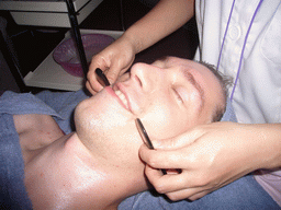 Tim having a facial massage at a massage salon in the city center