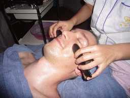 Tim having a facial massage at a massage salon in the city center