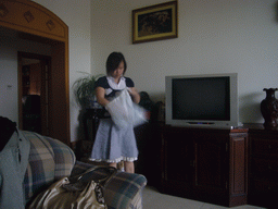 Miaomiao in the living room of her parents` apartment