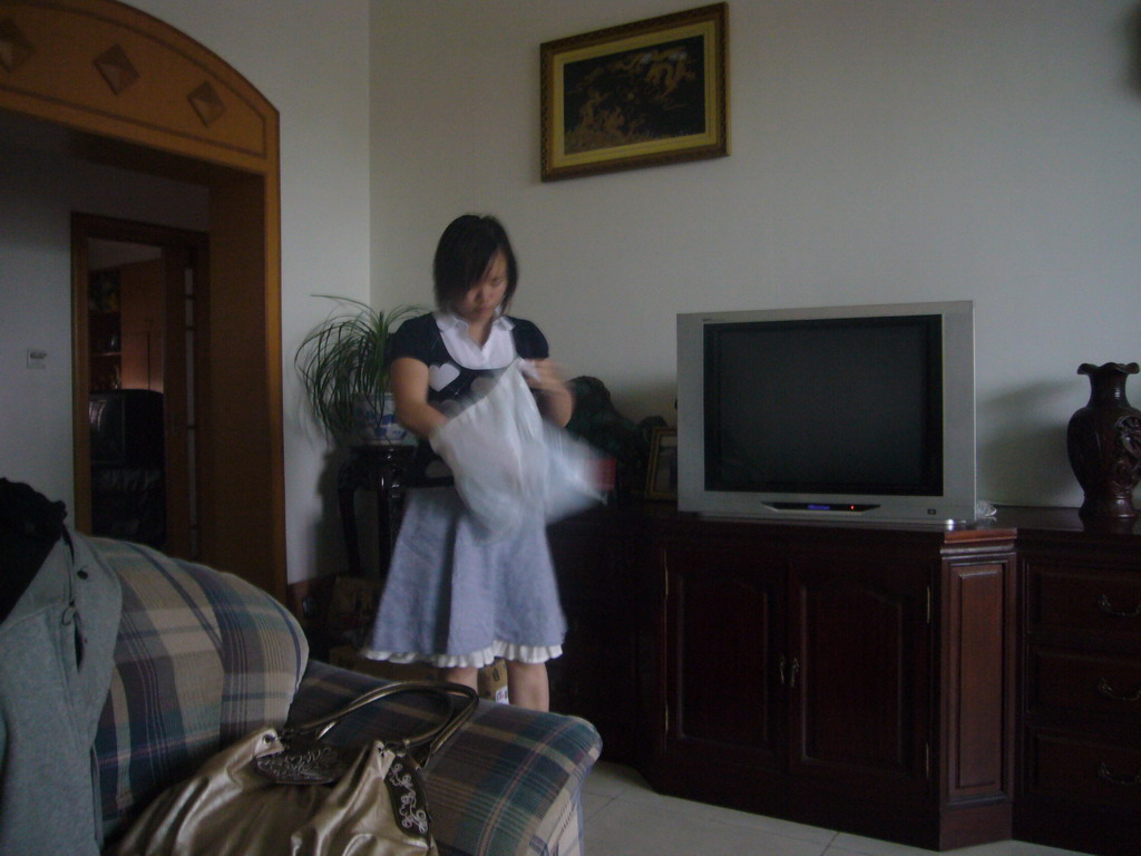 Miaomiao in the living room of her parents` apartment