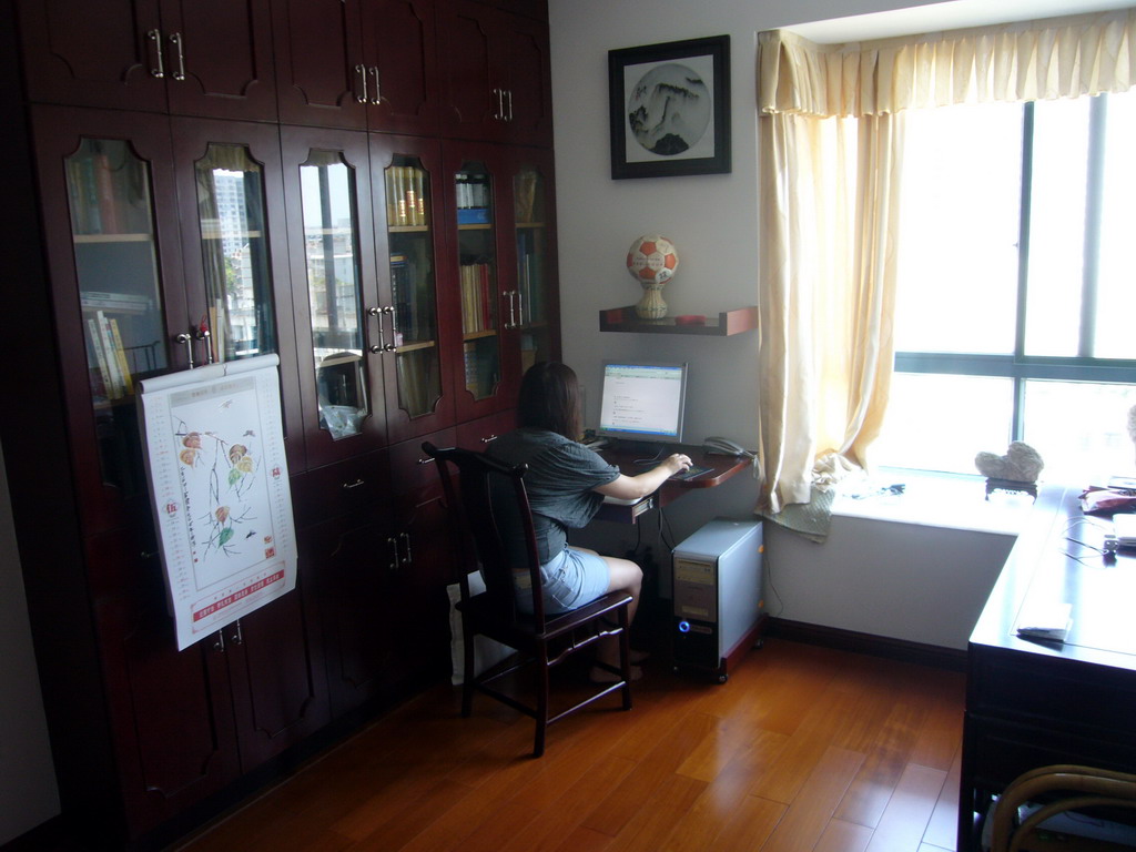 Miaomiao in the computer room in the apartment of Miaomiao`s parents