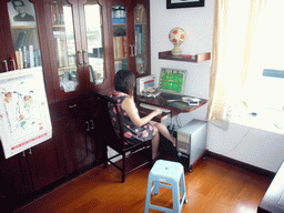 Miaomiao in the computer room in the apartment of Miaomiao`s parents