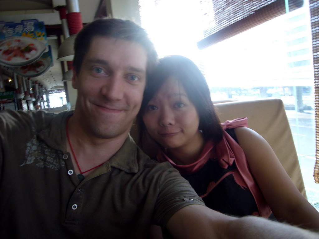 Tim and Miaomiao in a restaurant in the center of the city