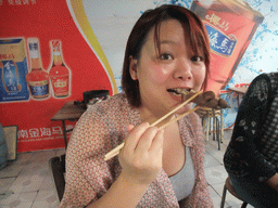 haikou_4_011 - 325 kb - 1024x768 - Miaomiao eating a dog`s leg in a restaurant in the city center Miaomiao eating a dog`s leg in a restaurant in the city center