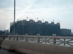 Apartment buildings, viewed from a car on the Qiongzhou Bridge over the Nandu River