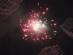 Fireworks at the square in front of Miaomiao`s parents` home, just before the Chinese New Year, by night