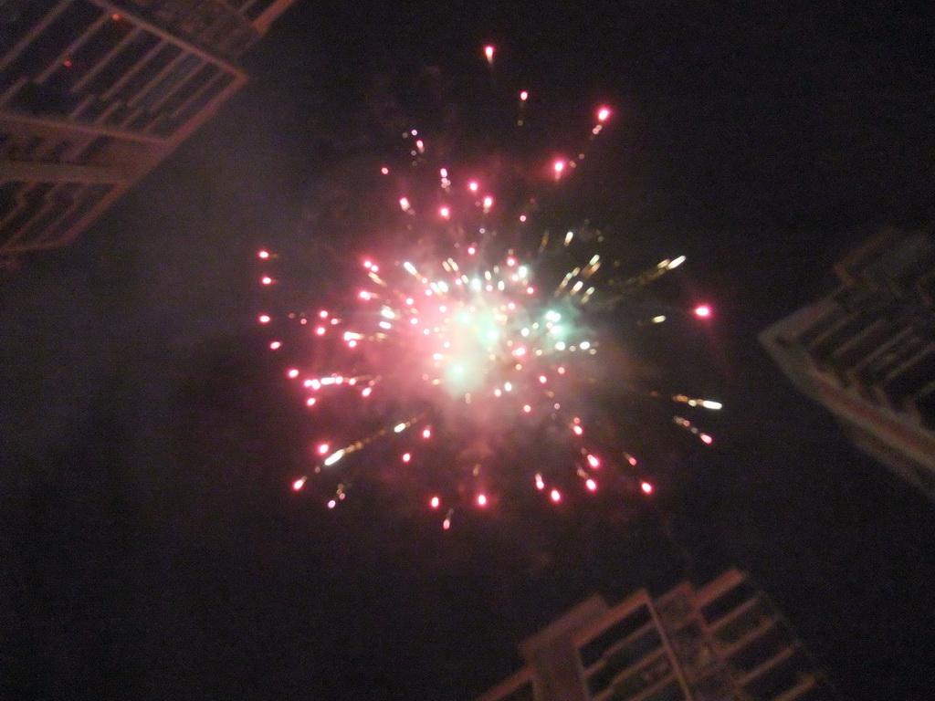 Fireworks at the square in front of Miaomiao`s parents` home, just before the Chinese New Year, by night