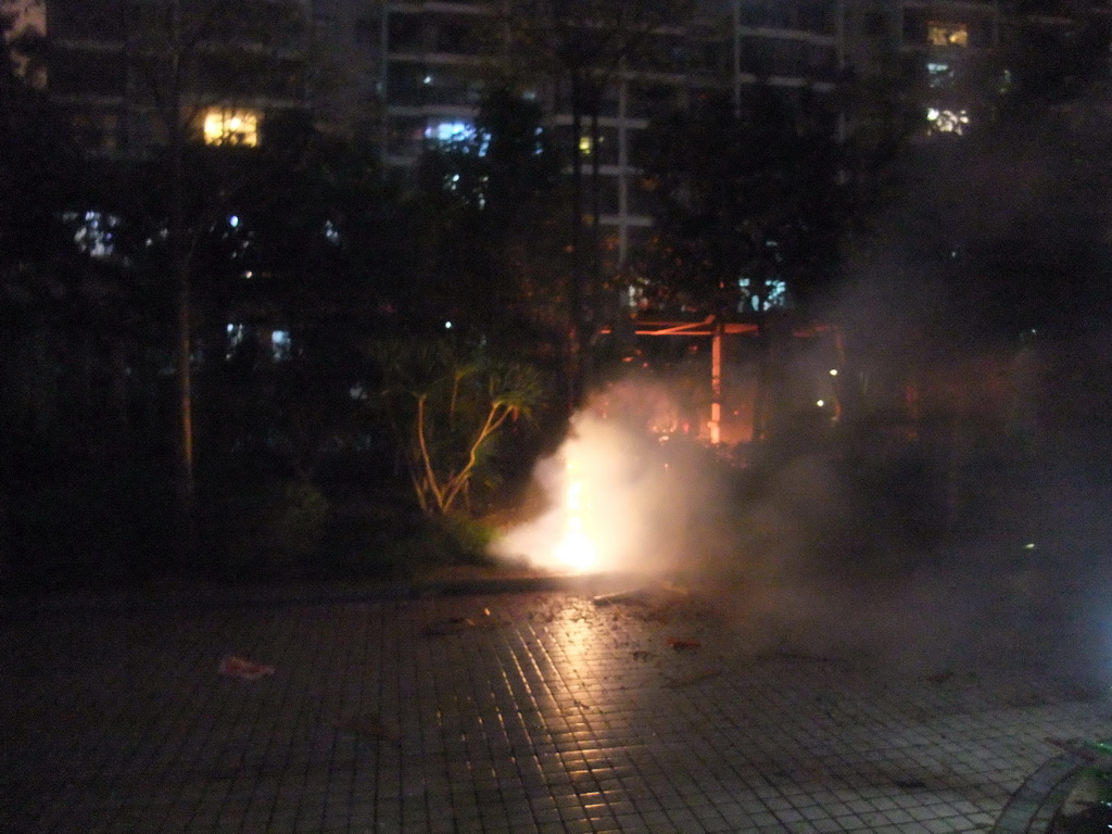 Fireworks at the square in front of Miaomiao`s parents` home, just before the Chinese New Year, by night