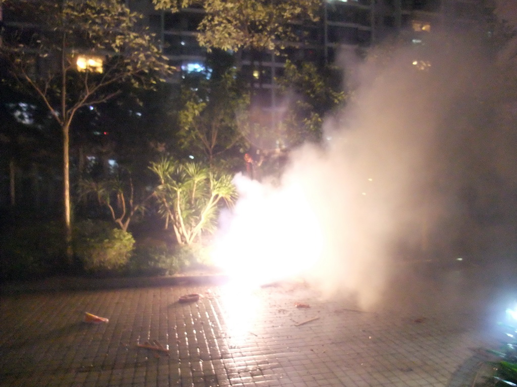 Fireworks at the square in front of Miaomiao`s parents` home, just before the Chinese New Year, by night