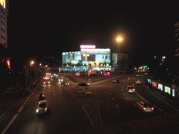 View on a road in the city center from a pedestrian bridge, by night