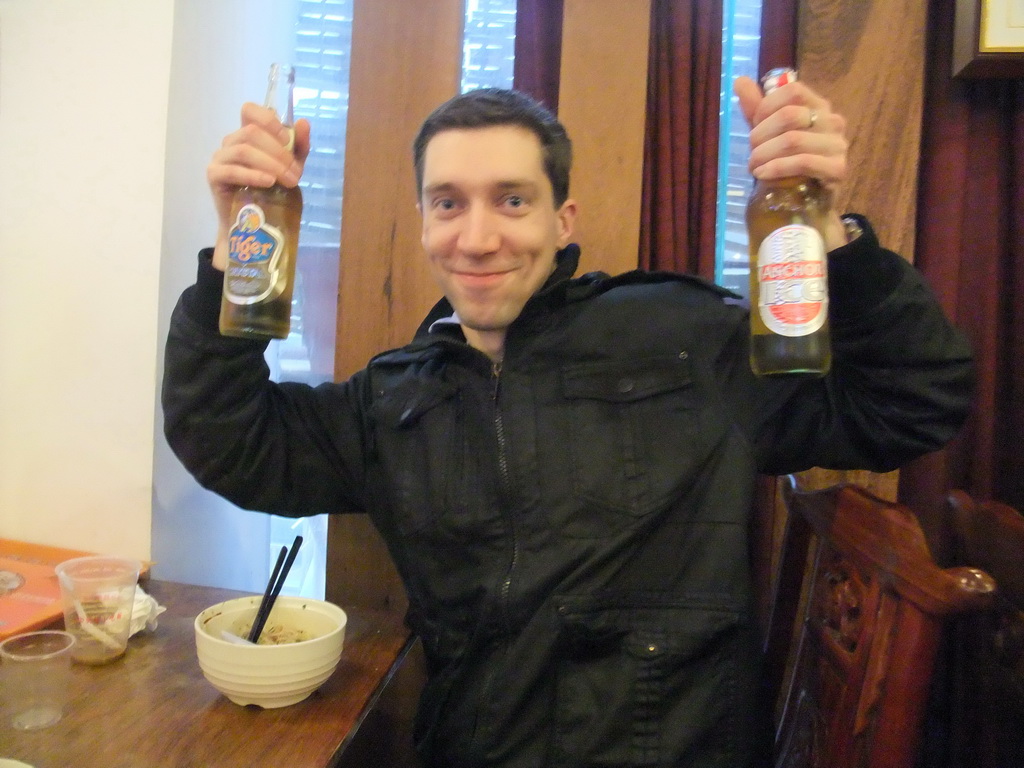 Tim with Anchor and Tiger beers at the Haikou Qilou Snack Street