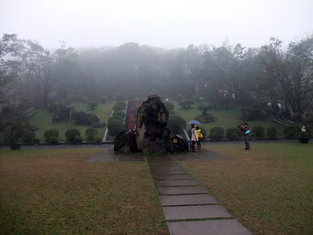 Rock, flowers and plants at the front of Mt. Fengluling volcano crater at the Hainan Volcano Park