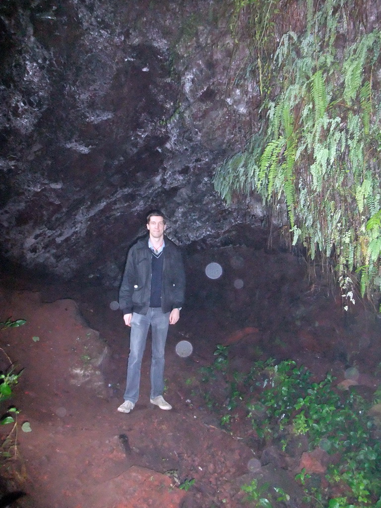 Tim in a cave at the Mt. Fengluling volcano crater at the Hainan Volcano Park