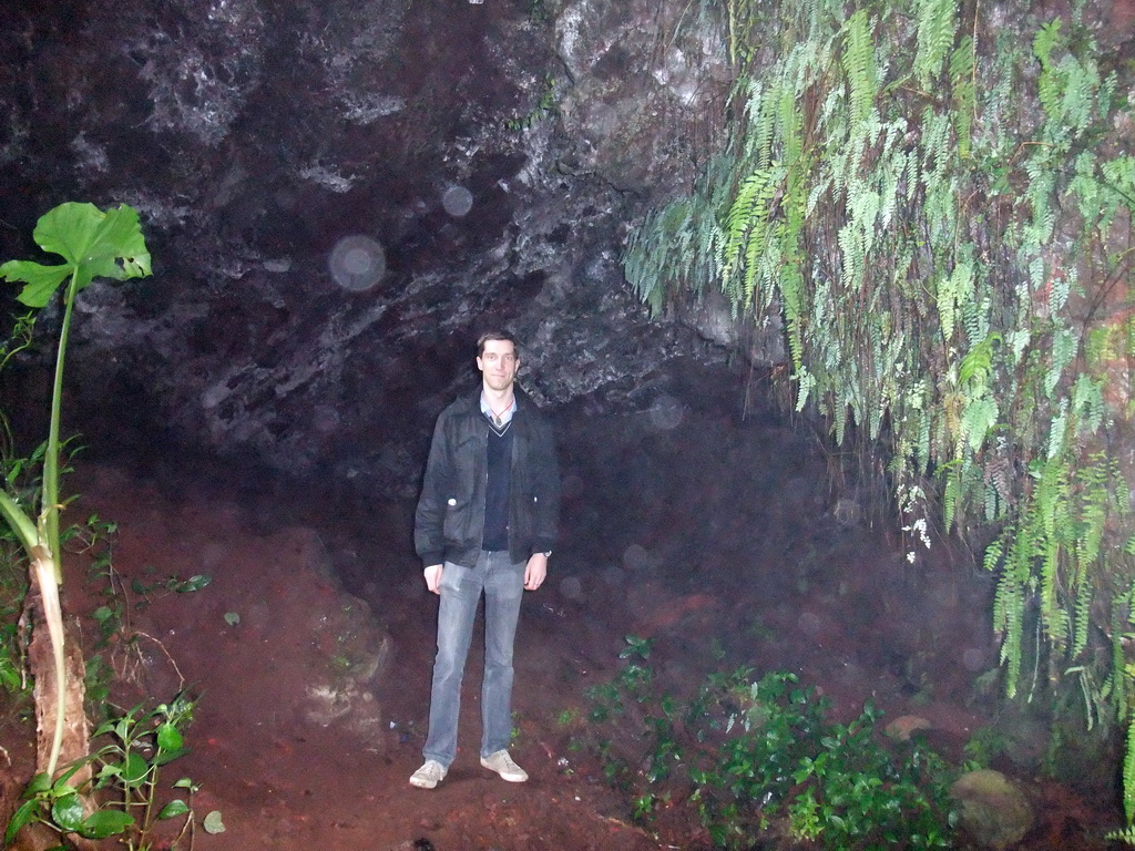 Tim in a cave at the Mt. Fengluling volcano crater at the Hainan Volcano Park