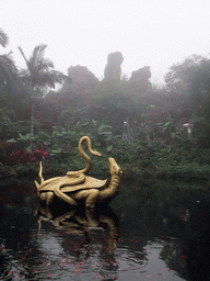 Pool with turtle and snake statue at the Hainan Volcano Park