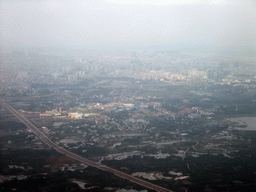 Skyline of Haikou and highways to the southeast of the city, viewed from the airplane from Zhengzhou