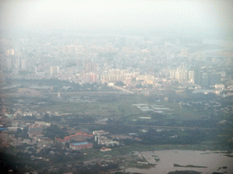 Skyline of Haikou and highways and lake to the southeast of the city, viewed from the airplane from Zhengzhou