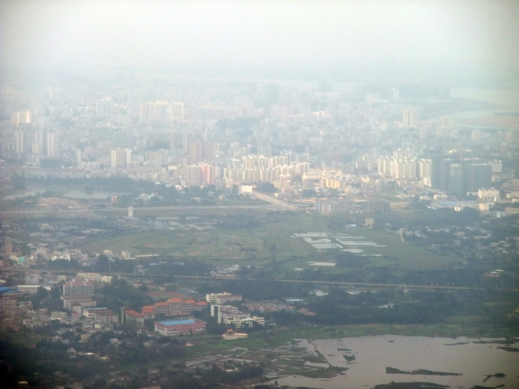 Skyline of Haikou and highways and lake to the southeast of the city, viewed from the airplane from Zhengzhou