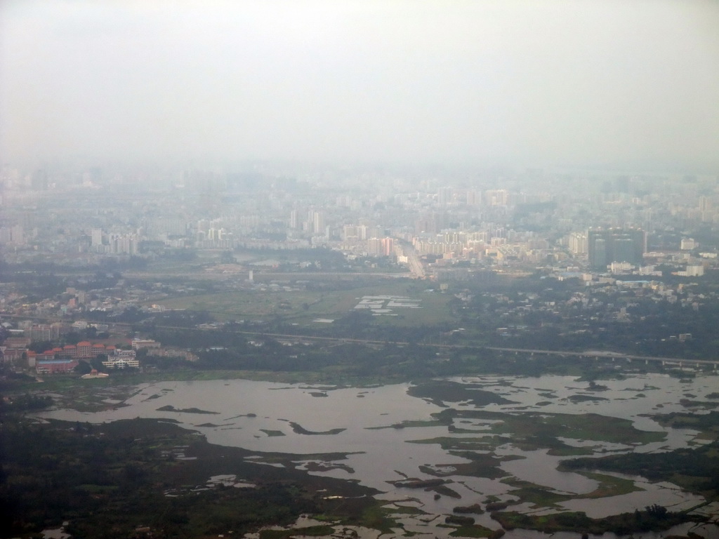 Skyline of Haikou and lakes to the southeast of the city, viewed from the airplane from Zhengzhou