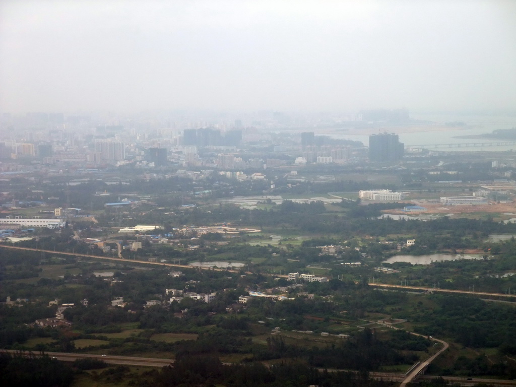 Skyline of Haikou and a bridge over the Nandu River, viewed from the airplane from Zhengzhou