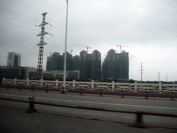 Apartment buildings, viewed from a car on the Qiongzhou Bridge over the Nandu River