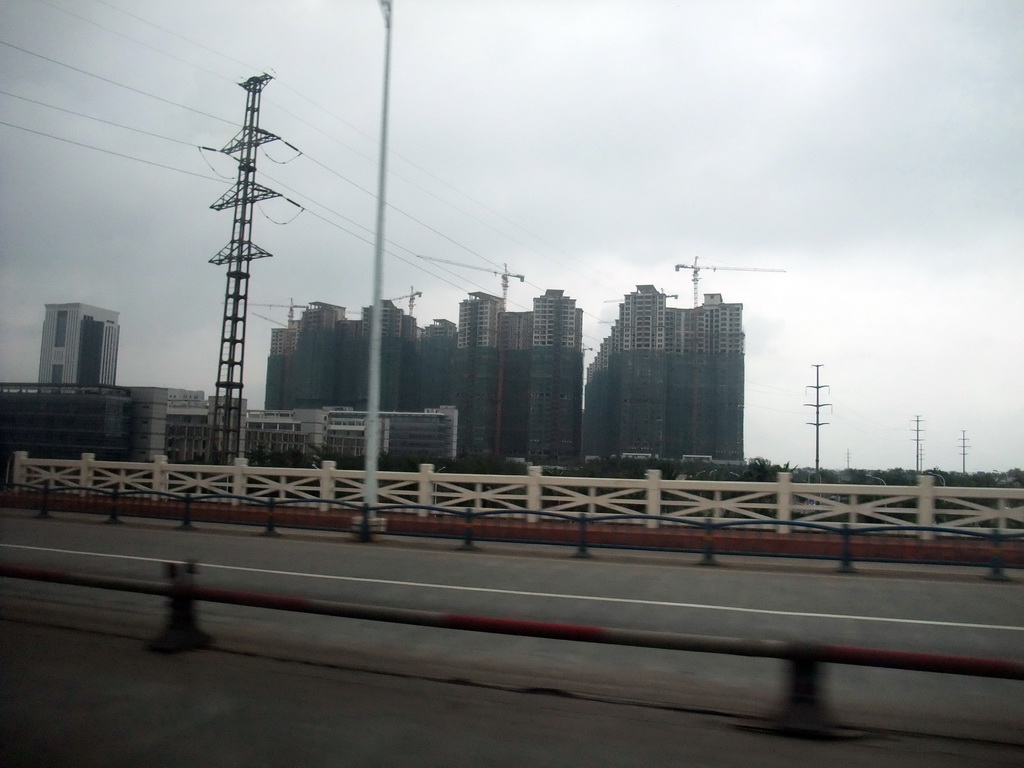 Apartment buildings, viewed from a car on the Qiongzhou Bridge over the Nandu River