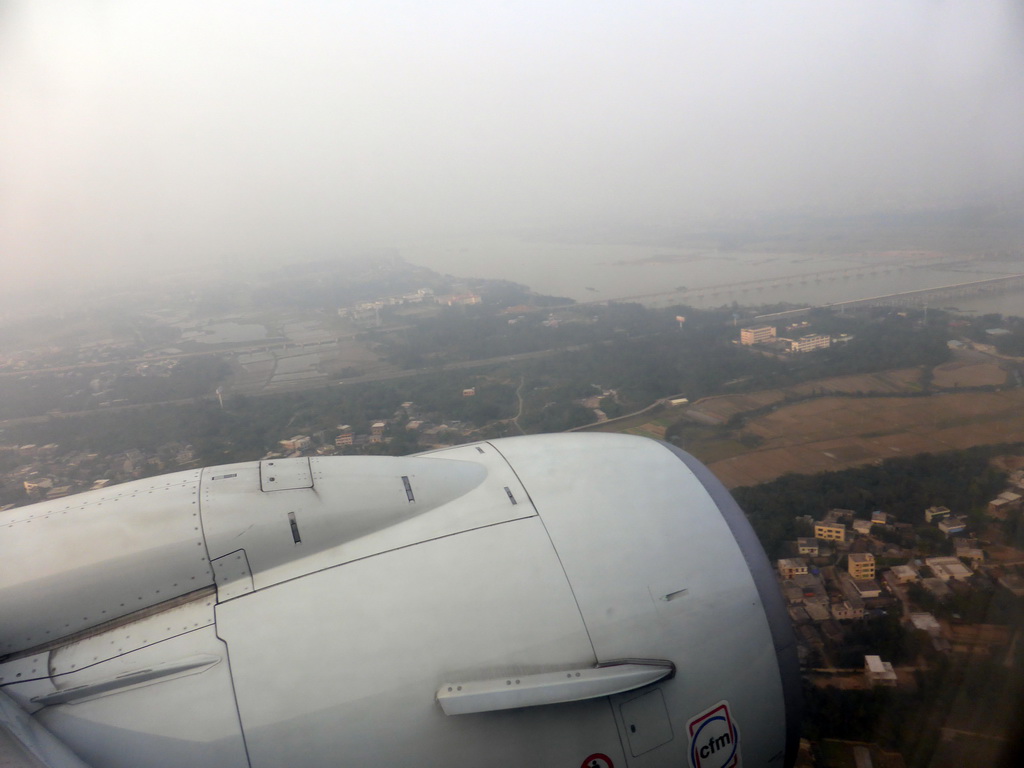 Area west of the Haikou Meilan International Airport with the railway bridge and the bridge of the G1501 highway over the Nandu River, viewed from the airplane from Xiamen