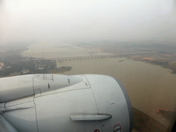 Area west of the Haikou Meilan International Airport with the railway bridge and the bridge of the G1501 highway over the Nandu River, viewed from the airplane from Xiamen