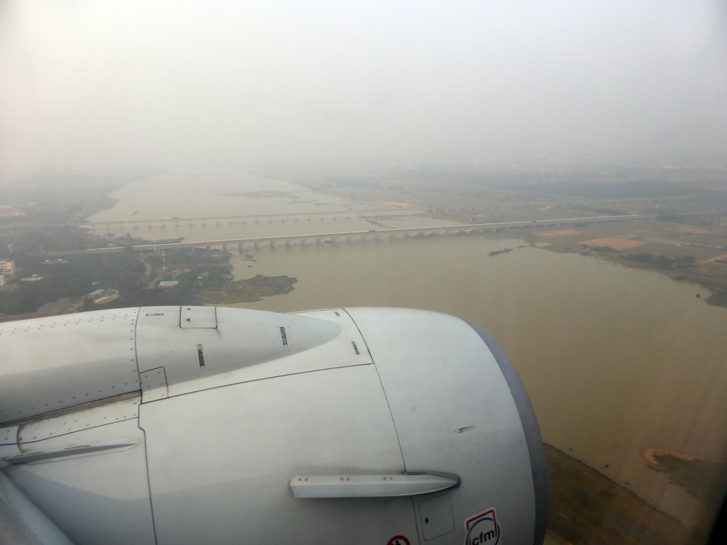 Area west of the Haikou Meilan International Airport with the railway bridge and the bridge of the G1501 highway over the Nandu River, viewed from the airplane from Xiamen