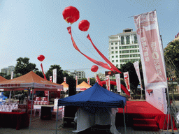 Square with stalls and paper lanterns in the city center