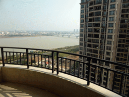 The east side of the city with the Qiongzhou Bridge over the Nandu River, viewed from the balcony of the apartment of Miaomiao`s sister