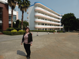 Miaomiao in front of the east building of the Hainan Overseas Chinese Middle School