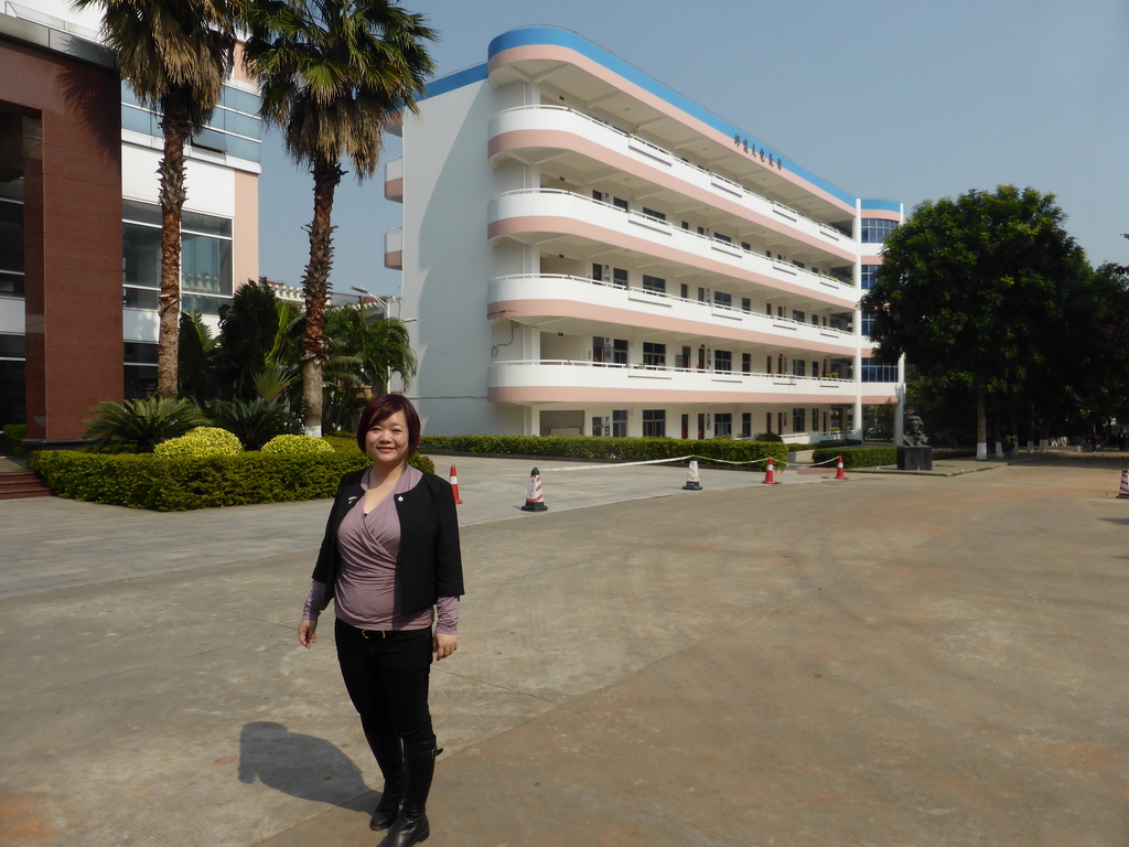 Miaomiao in front of the east building of the Hainan Overseas Chinese Middle School