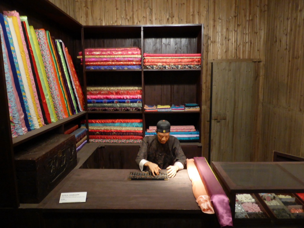 Wax figure in an old curtain shop in Haikou, at the `Exhibition of History of Hainan V: Modern Qiongya` at the middle floor of the Hainan Provincial Museum