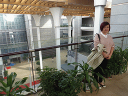 Miaomiao at the top floor of the Hainan Provincial Museum, with a view on the central hall