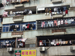 Clothing hanging to dry on balconies at Nanbao Road