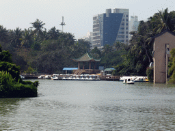 Pavilion and boats in Donghu Lake at Haikou People`s Park