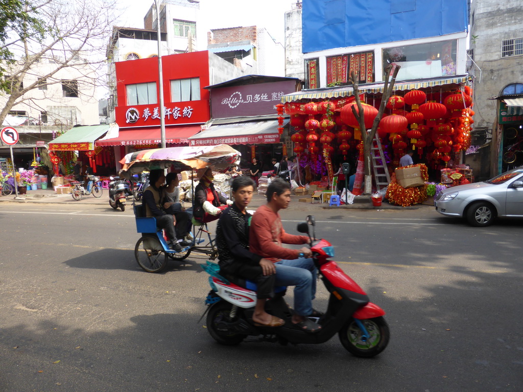 Rickshaw and scooter at Bo`Ai South Road