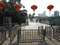 North entrance gates and pedestrian bridge at Haikou People`s Park at Donghu Road
