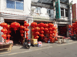 Shops with paper lanterns in old buildings at Bo`Ai South Road