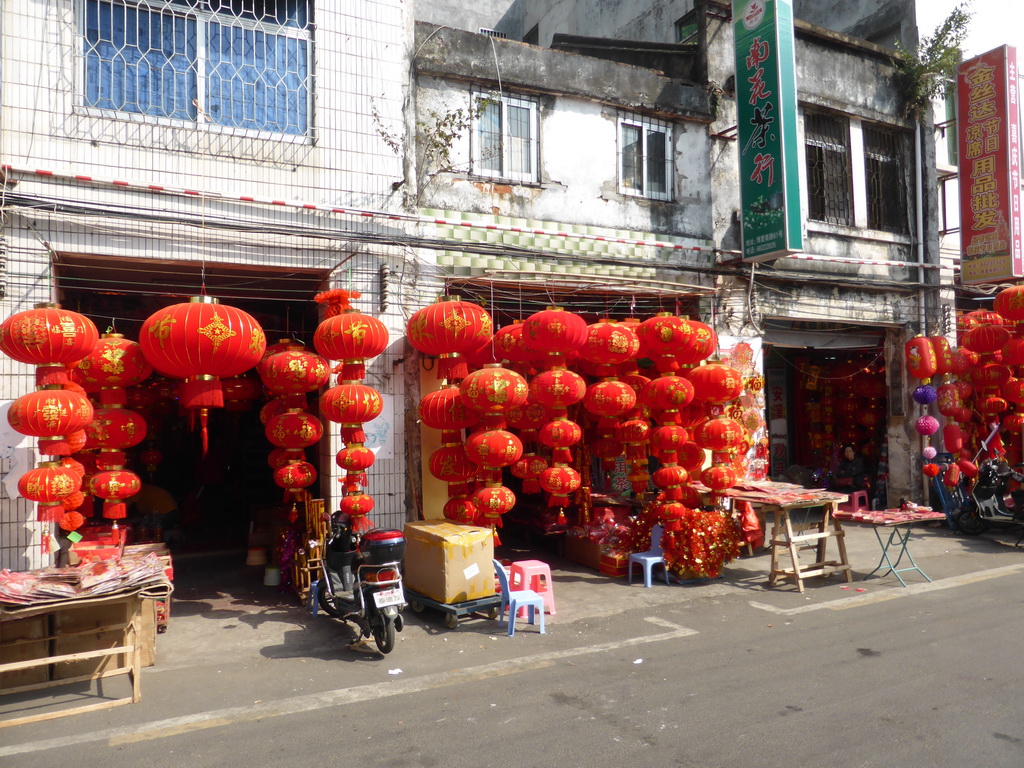 Shops with paper lanterns in old buildings at Bo`Ai South Road