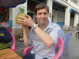 Tim with a coconut at a terrace at Zhongshan Road