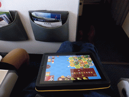 Tim with our iPad and a lot of leg space in the airplane to Xiamen
