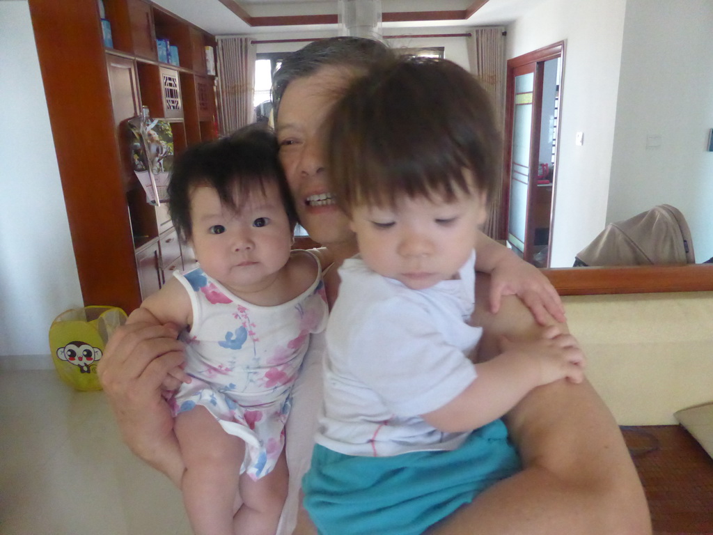 Max with his grandfather and cousin in the apartment of Miaomiao`s sister